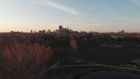 Aerial-footage-Minneapolis-skyline-during-golden-hour-view-from-far-away
