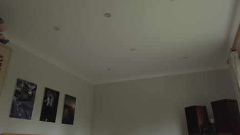 Upward-Tilt-Shot-of-a-Modern-Looking-Bedroom-in-a-Family-Home