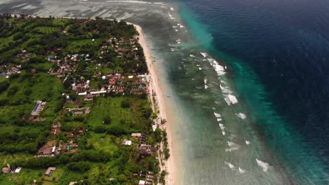 Aerial-view-of-a-beautiful-coastline-with-the-incoming-waves