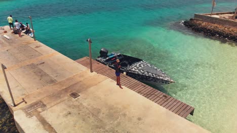 Aerial-footage-of-a-model-drinking-a-beer-at-the-amazing-beach-on-Petit-St-Vincent