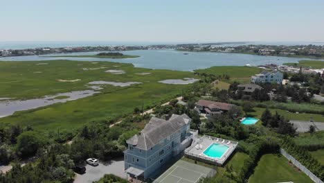 drone-flying-over-a-home-in-The-Hamptons
