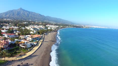 flying-over-marbella-coastline,-perfect-view-of-beach-sea-and-mountain