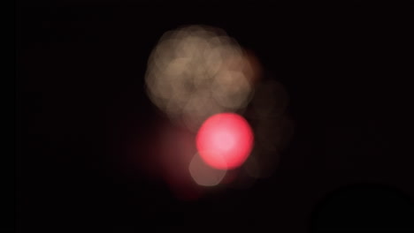 Wide-shot-of-bokeh-patterns-created-by-out-of-focus-fireworks-in-the-distance