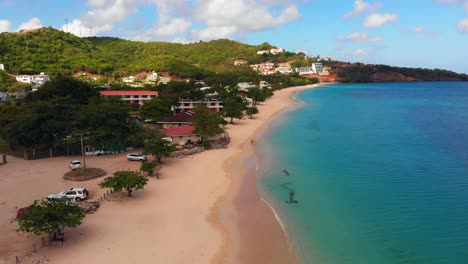 Epic-aerial-of-the-most-amazing-clear-water-beach-in-the-Caribbean,-Grand-Anse-Beach,-Grenada
