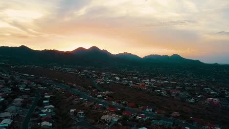 Fountain-Hills-AZ-as-seen-from-a-drone,-aerial-sunset-shot