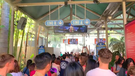 People-waiting-in-line-for-newly-opened-Jurassic-World-THE-RIDE,-at-Universal-Studios-Hollywood
