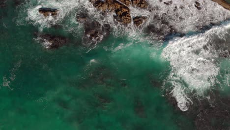 Drone-view-zooming-out-as-waves-roles-in