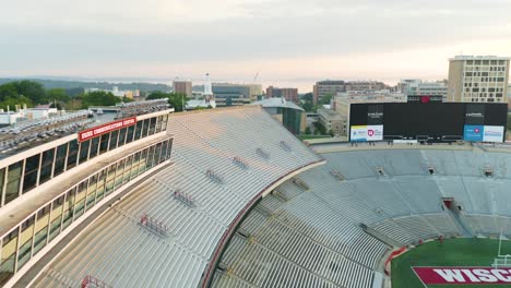 Aerial-fly-over,-empty-grandstand-seats-in-Wisconsin-Badgers-football-stadium