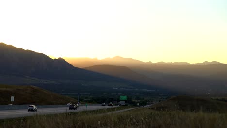 Traffic-flow-on-US36-against-a-background-of-mountains-and-sunset