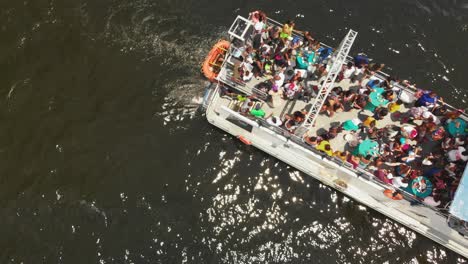 Aerial-footage-of-partygoers-aboard-a-vessel-in-the-open-sea-enjoying-the-music