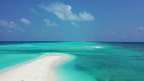White-sand-sandbar-in-the-middle-of-the-endless-turquoise-sea