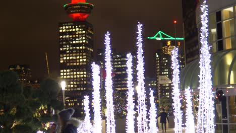 Girl-posing-infront-of-Illuminated-city-decoration-in-downton-Vancouver