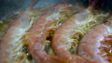 Detail-shot-of-raw-prawns-frying-in-pan
