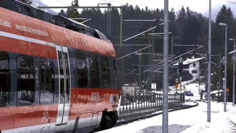 Slow-motion-of-train-leaving-frozen-snow-train-station