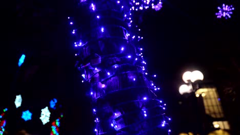 Tilting-footage-of-holiday-lights-decoration-on-a-tree