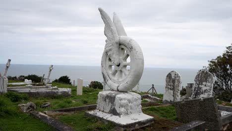 Llandudno-Orme-coastal-mountain-graveyard-motorcyclist-winged-wheel-cemetery-grave-monument-dolly-right