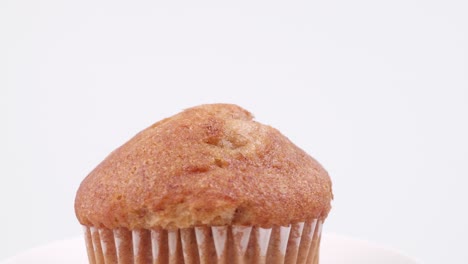 Muffins-banana-with-white-background-shallow-focus-and-slowly-rotating
