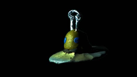 Clay-Figure-Of-Spaceship-Spinning-Over-Black-Background---Outer-Space-Concept---studio-shot