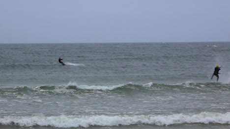 Two-men-kite-surfing-during-winter-on-Baltic-sea