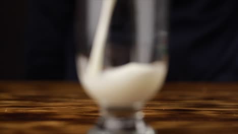 Serving-milk-on-glass-slow-motion-macro-shot-120-fps