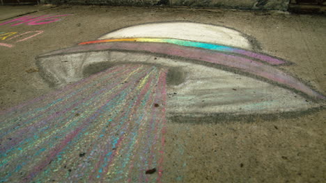 UFO-sidewalk-chalk-art,-Close-Up,-Slide-Left