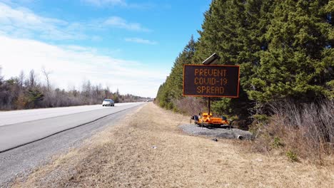 Construction-Sign-on-Highway-Warning-about-Covid-19-Spread-Coronavirus