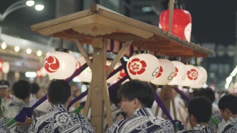 Kyoto,-Japan---Beautiful-Lanterns-With-Group-Of-People-In-Kimono-Playing-Loud-Music-In-Hiyori-Kagura-Parade-During-Yoiyama-Festival-At-The-Gion-Matsuri-Festival-At-Night---Mid-Shot