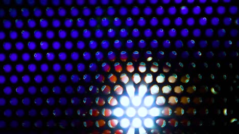 Colorful-loop-background-with-holes-glowing-of-different-lights-in-motion,-digital-wallpaper-for-stage