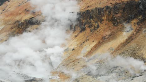 Pan-left-close-up-view-of-the-steaming-volcanic-area-at-Jigokudani-,-Noboribetsu