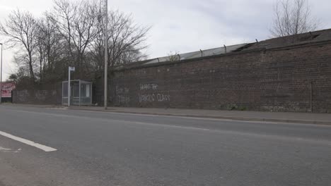 Wide-shot-of-an-anti--government-graffiti-on-a-brick-wall