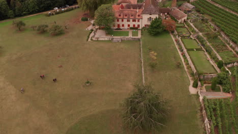 Aerial-reveal-of-beautiful-old-building-in-Swiss-countryside