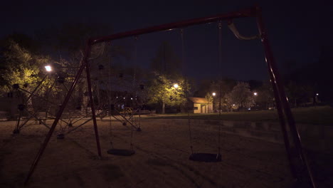 Swings,climbing-bars,empty-playground-at-night,Prague,Czechia,during-lockdown