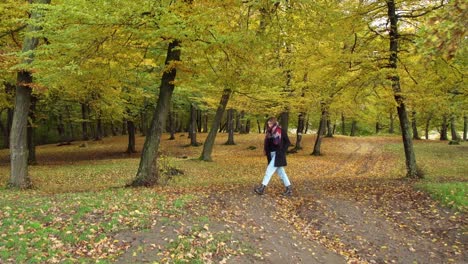 Girl-Walking-At-Hoia-Forest-During-Autumn-In-Cluj-Napoca,-Romania