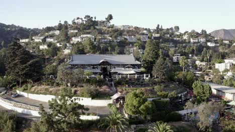 Aerial-view,-the-Yamashiro-restaurant,-Oriental-Gardens,-Hollywood,-rising-tilt
