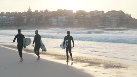 Pro-surfers-walking-with-pride-at-Bondi-beach-Sydney-in-slow-motion