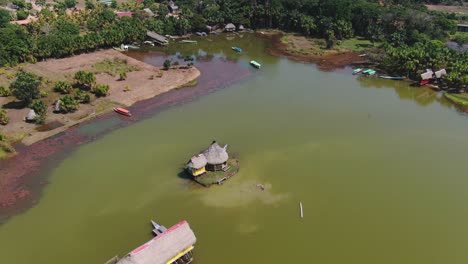 4K-daytime-aerial-drone-view---a-beautiful-house-over-the-water-at-Laguna-de-los-Milagros-,-Tingo-Maria---Gate-to-the-Amazon-in-Peru