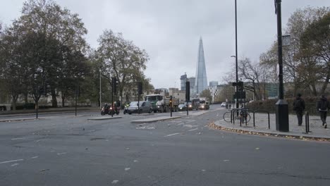 Busy-junction-in-London-autumn-with-Shard-building-in-background