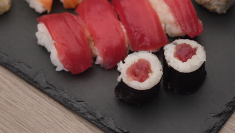 Asian-food-sushi-maki-nigiri-salmon,-tuna,-hosomaki-and-uramaki