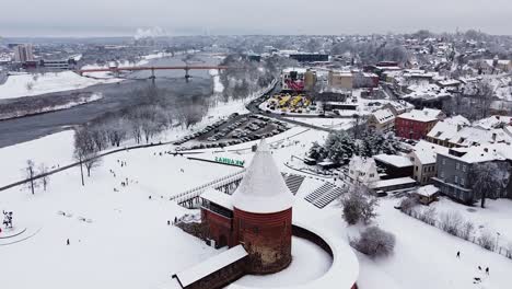 Aerial-shot-of-Kaunas-Castle-and-city-skyline-in-winter-season