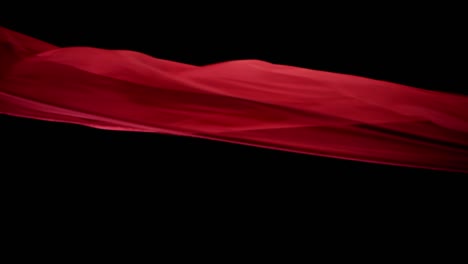 Roter,-Seidiger-Stoff,-Der-Wunderschön-In-Der-Luft-Schwebt,-Mit-Schwarzem-Hintergrund---Studioaufnahme