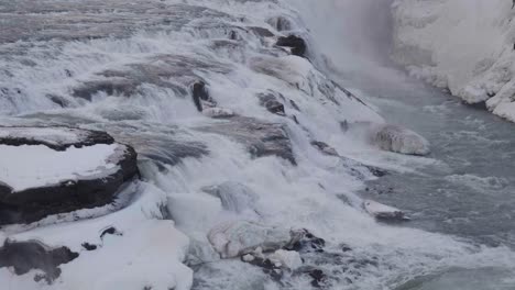Static,-slow-motion,-medium-shot-of-gullfoss-waterfalls,-on-a-cloudy-day,-in-South-coast-of-Iceland