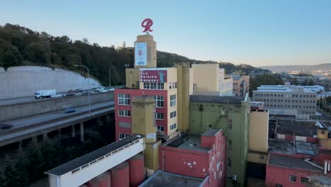 Orbiting-the-Old-Rainier-Brewery-in-south-Seattle-along-Interstate-5,-aerial