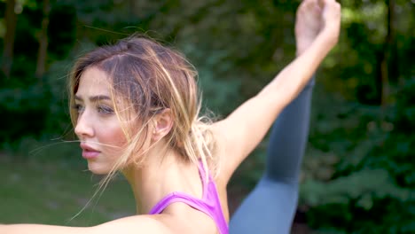 Close-up-of-woman-doing-yoga-in-a-park