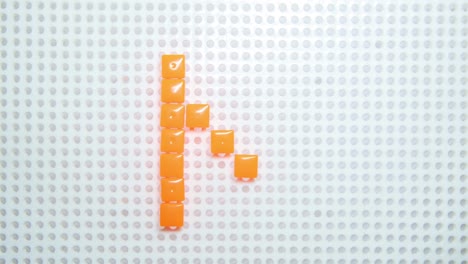 stop-motion-of-the-letter-N-creating-one-pixel-at-the-time,-made-with-children-toys