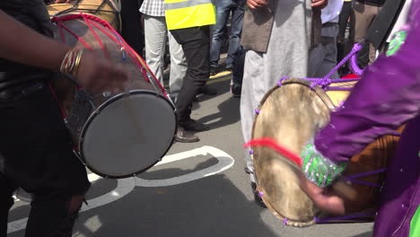 UK-Worcester-2018---A-close-up-of-two-men-play-Bhangra-Dhol-drums-during-a-protest-against-a-far-right-march