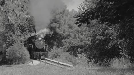 Steam-Train-Puffing-Along-Amish-Farmlands-as-Seen-by-Drone-in-Black-and-White