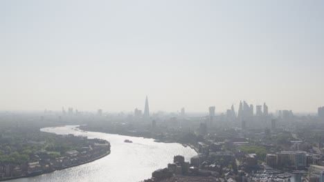 Elevated-aerial-pan-down-of-central-and-greater-london-featuring-the-Thames-river