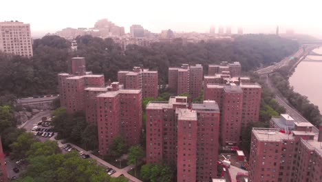 Drone-flyover-of-Harlem-NYC-projects-at-hot-hazy-sunrise-in-4K