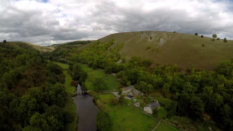 Aerial-view-of-the-farm-by-Headstone-viaduct,-bridge-in-the-Derbyshire-Peak-District-National-Park,-Bakewell,-commonly-used-by-cyclists,-hikers,-popular-with-tourists-and-holiday-makers