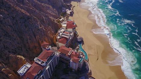 This-is-4K-drone-footage-of-a-resort,-on-the-beach,-in-Cabo-San-Lucas-Mexico